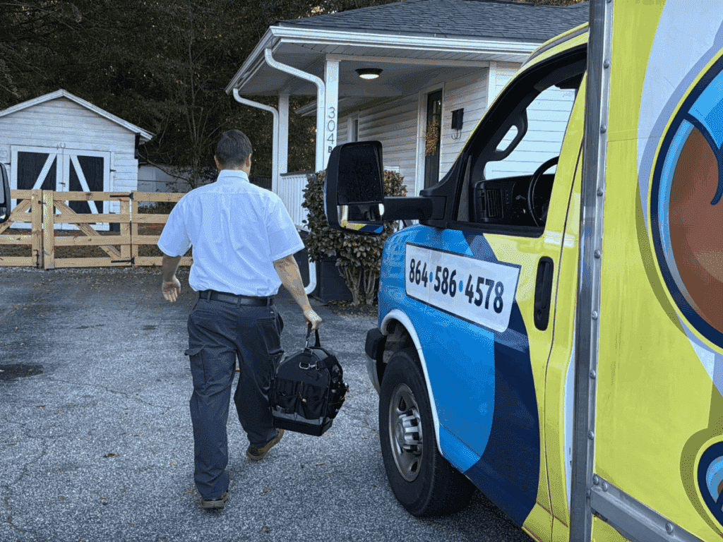 Tech and truck. Tech approching customer's home.