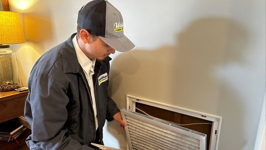 Waldrop technician replacing an air filter